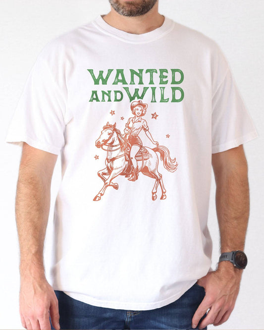 Model wearing white color shirt with 'Wanted And Wild' graphic design