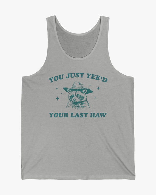 Flat laying heather gray 'You Just Yeed Your Last Haw' tank top with funny retro cowboy raccoon graphic