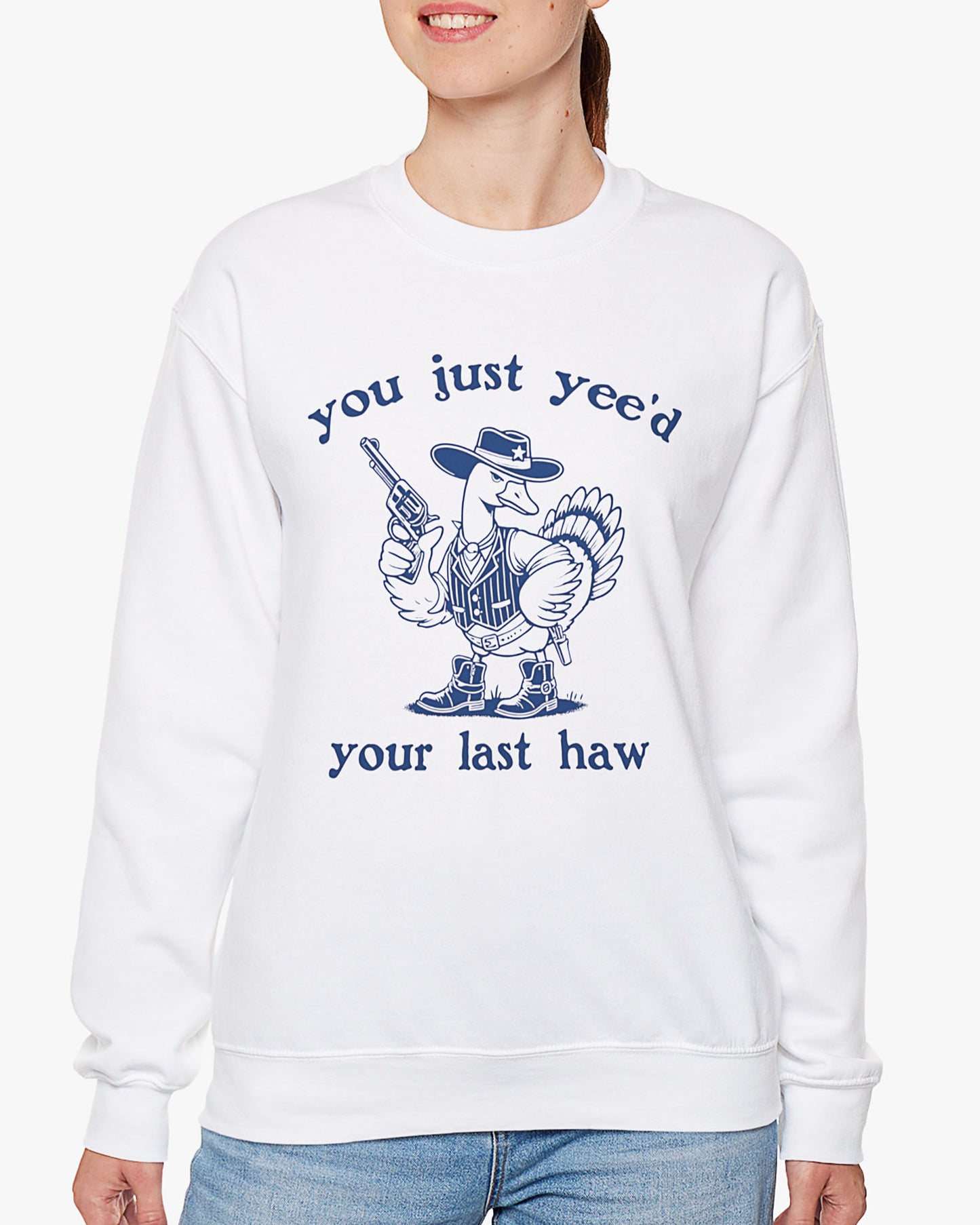 Woman wearing white 'You Just Yeed Your Last Haw' sweatshirt with funny retro cowboy goose graphic