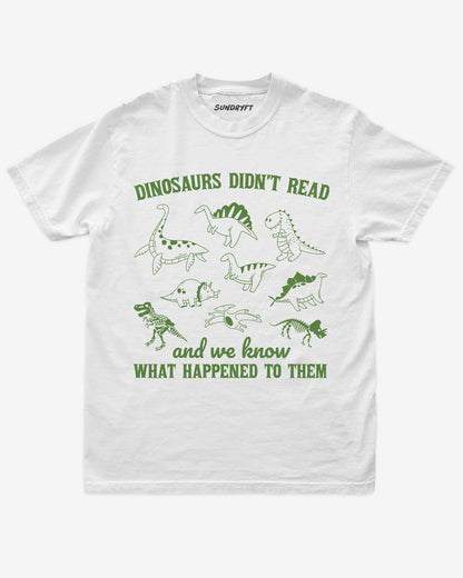 Dinosaurs Didn't Read And We Know What Happened shirt in white with dinosaur collage doodle graphic