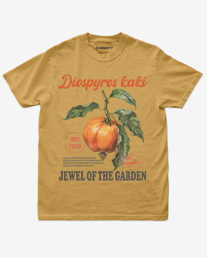 Diospyros Kaki Fruit Shirt flat lay in mustard – retro 90s vintage graphic tee with relaxed unisex fit and garden fruit label design.