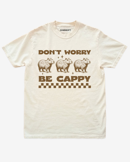 Don't Worry Be Cappy shirt in ivory with capybara graphic
