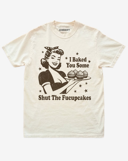 Ivory “I Baked You Some Shut The Fucupcakes” funny sarcastic baking shirt flat lay.