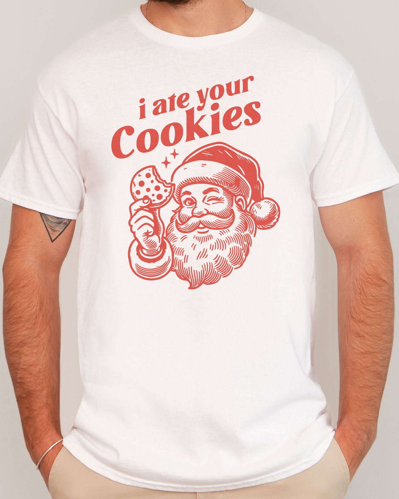 Man wearing funny retro Santa Clause graphic tee with the quote I Ate Your Cookies