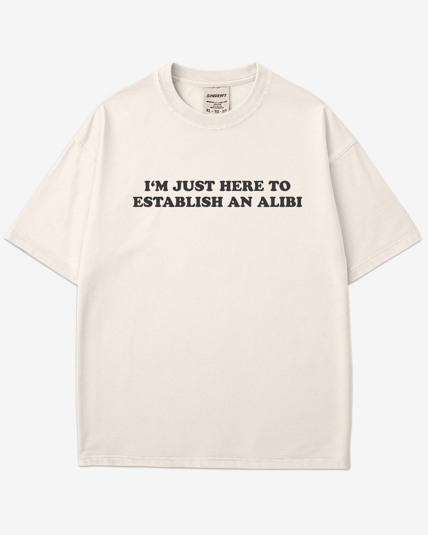 Flat lay ivory I'm Just Here To Establish An Alibi shirt.