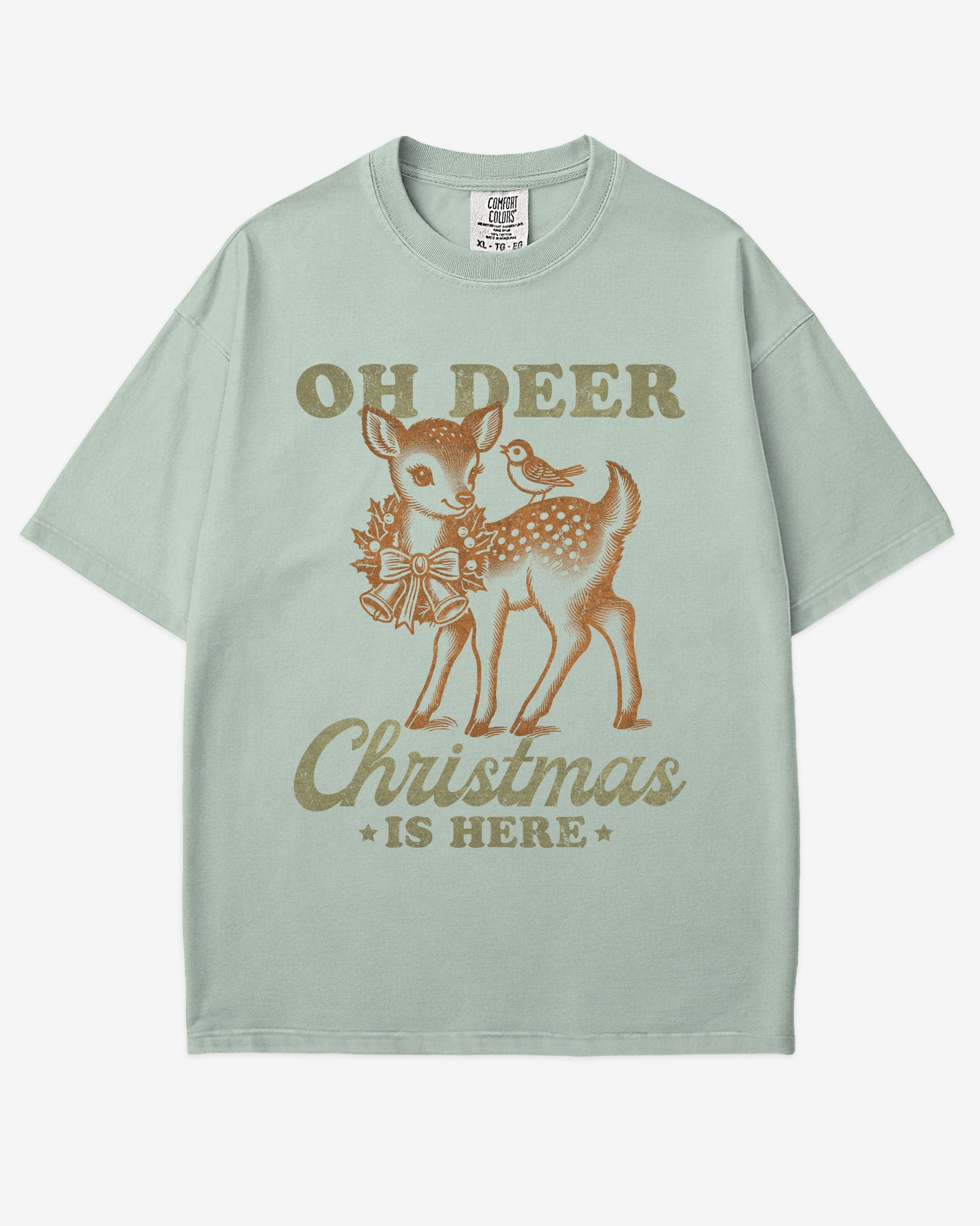Oh Deer Christmas Is Here shirt in bay color with retro graphic of a little reindeer