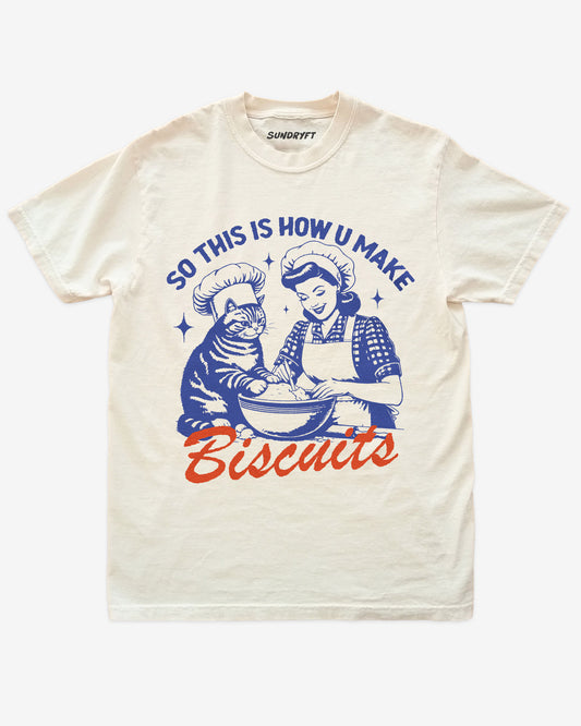 So This Is How You Make Biscuits shirt in ivory with funny retro graphic of cat and woman making biscuits together