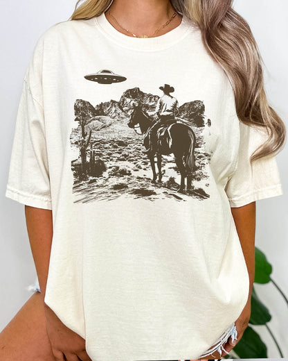 Woman wearing a retro UFO Western graphic shirt in natural color