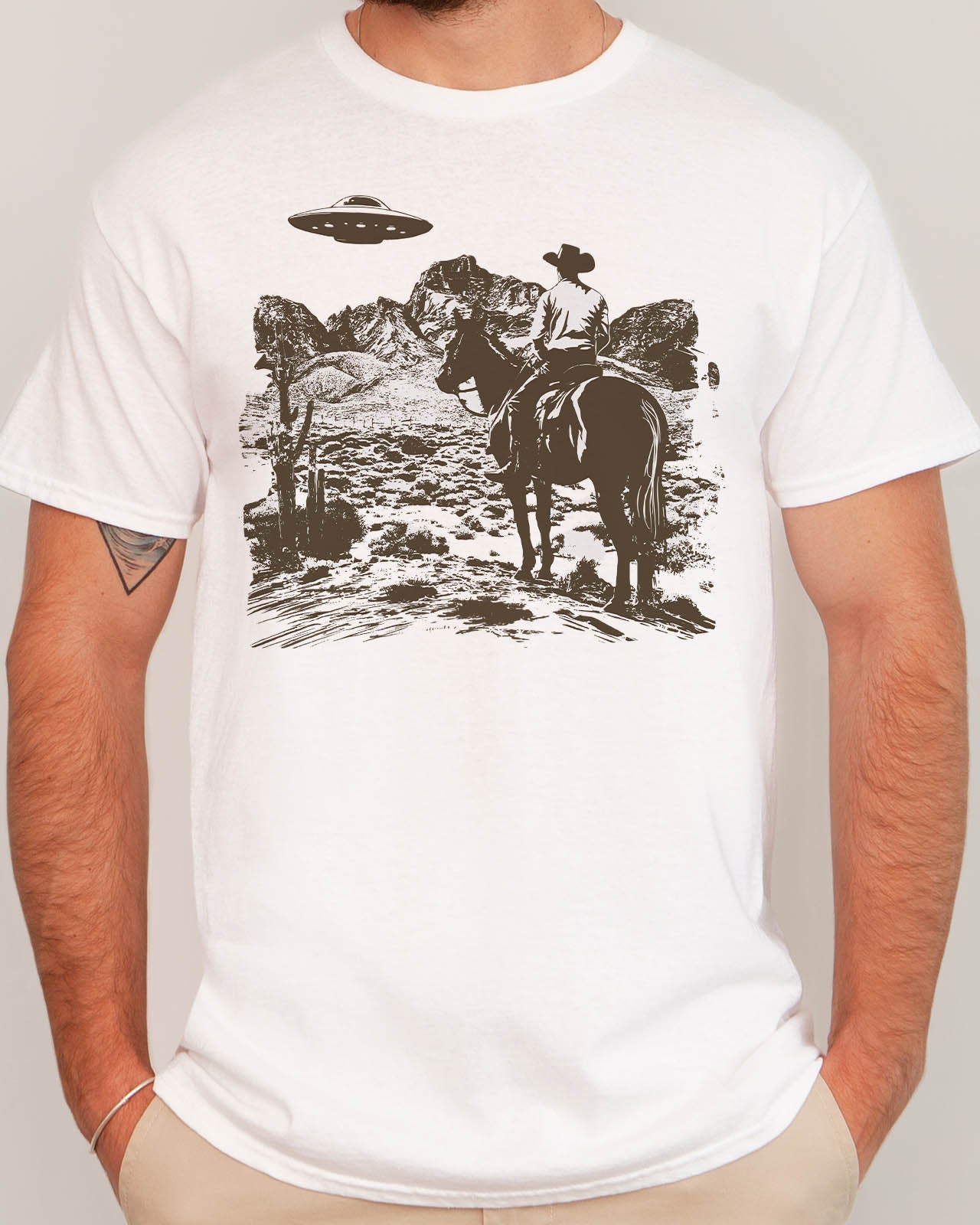 Man wearing a retro UFO Western graphic shirt in white color