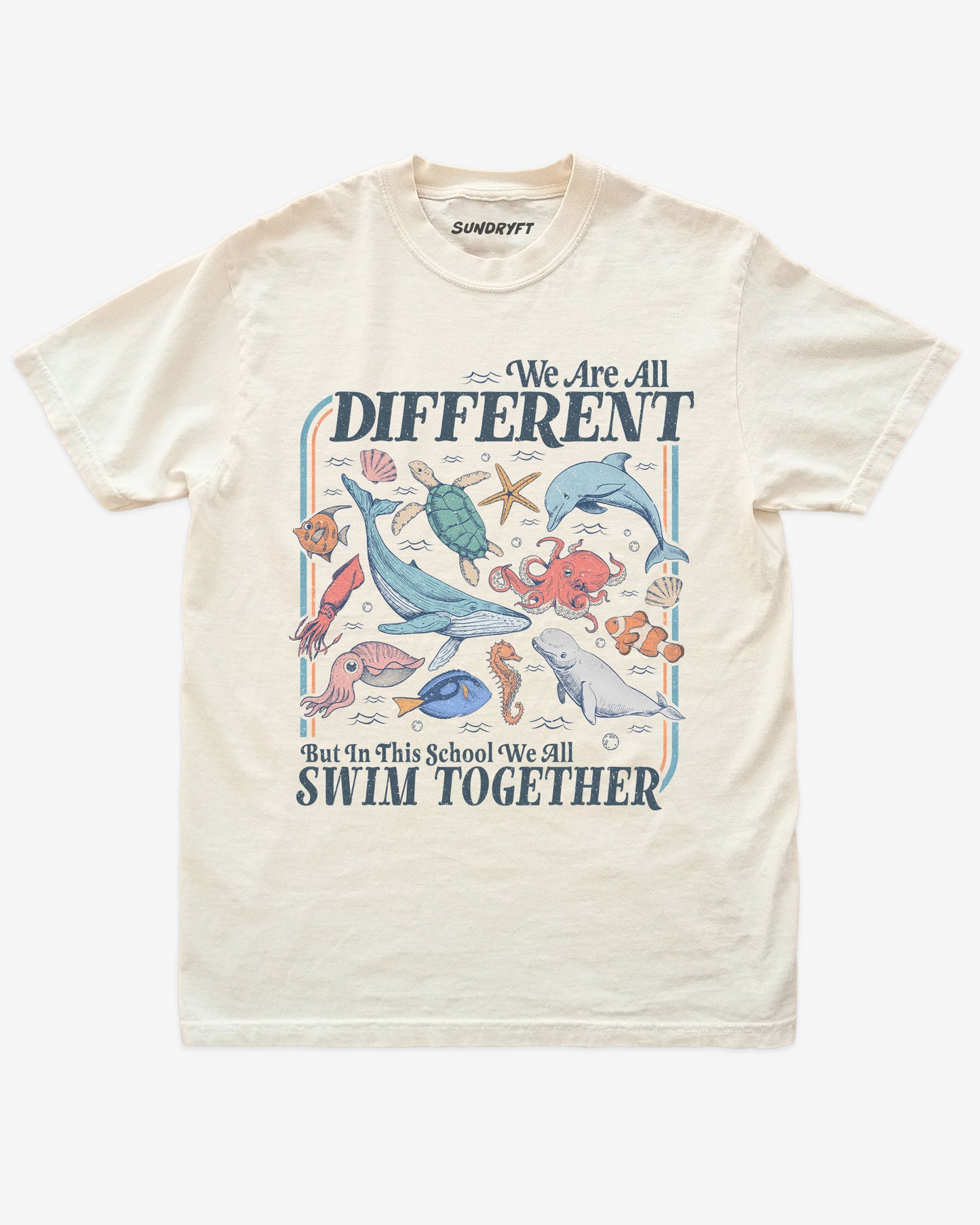 Flat lay of ivory We Are All Different But In This School We All Swim Together Shirt with cute retro ocean animal design