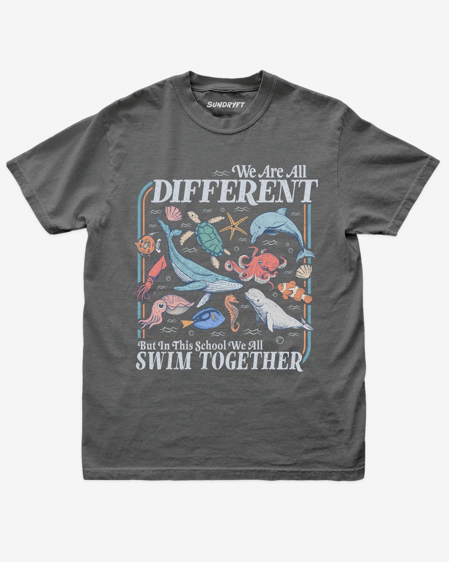 Flat lay of pepper We Are All Different But In This School We All Swim Together Shirt with cute retro ocean animal design