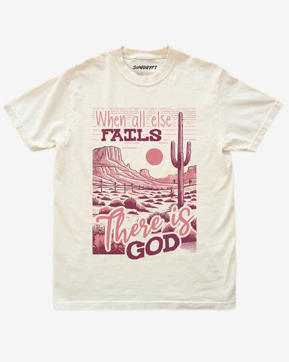 When All Else Fails There Is God shirt in ivory with retro graphic of western desert scenery