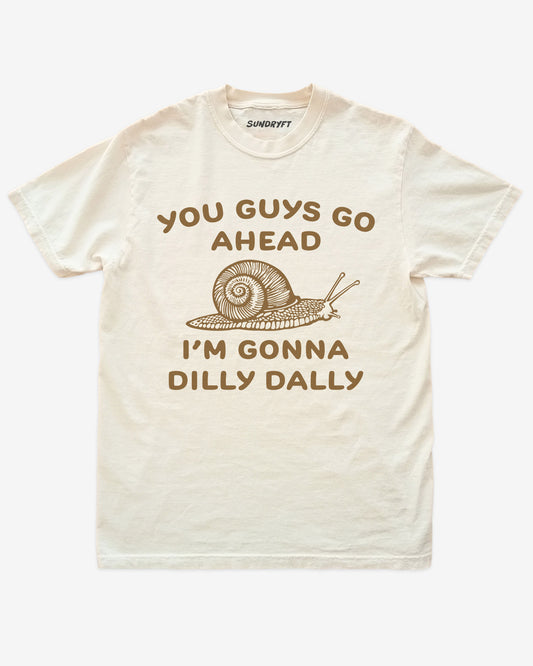 You Guys Go Ahead I’m Gonna Dilly Dally shirt in ivory with snale graphic