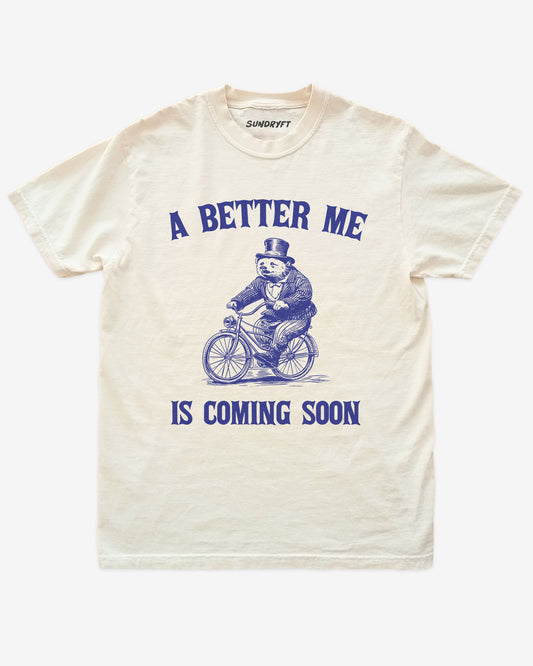 A Better Me Is Coming shirt with retro graphic of bear riding bicycle