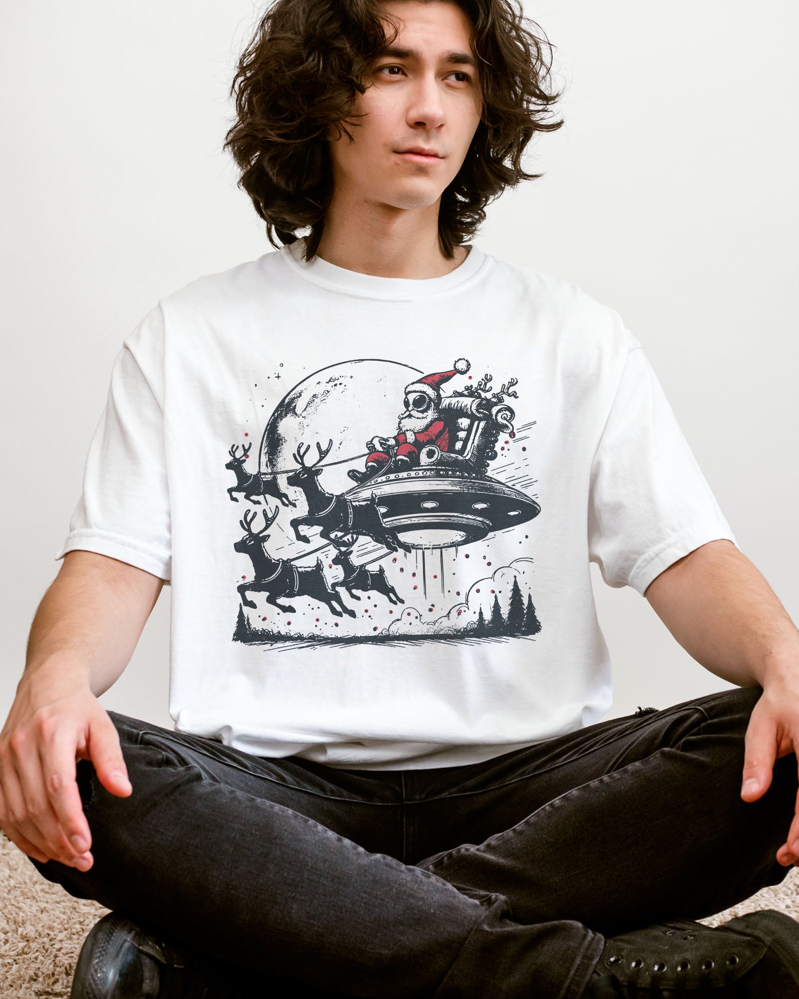 Man wearing an alien Santa graphic tee in white color.