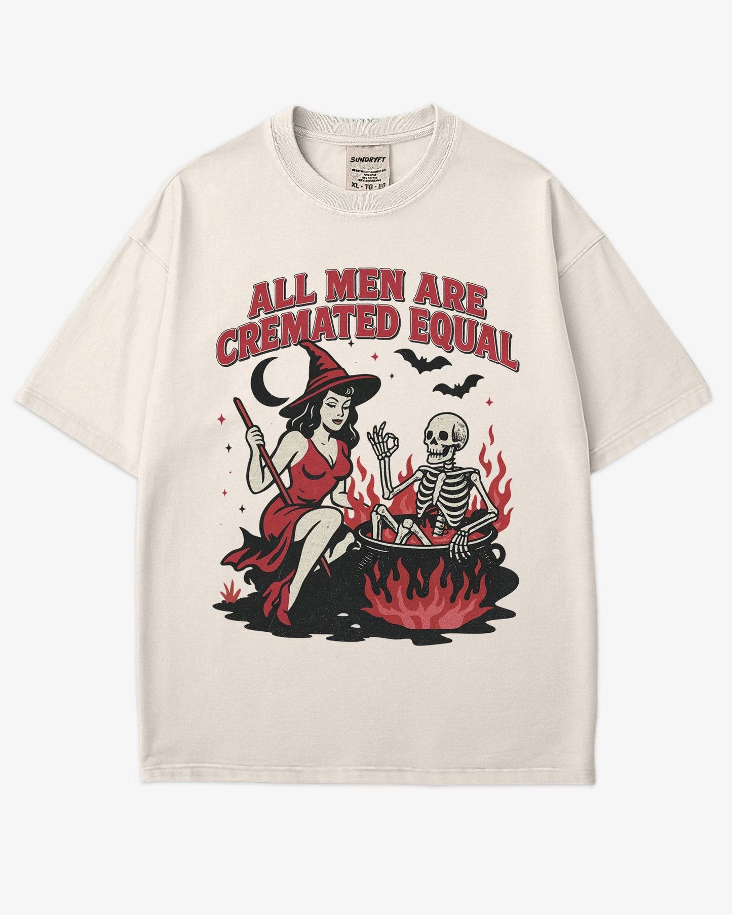 Flat lay ivory “All Men Are Cremated Equal” shirt with a retro Halloween graphic of a witch stirring a skeleton in a cauldron.