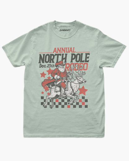 Annual North Pole Rodeo shirt in bay with cowboy Santa riding reindeer graphic