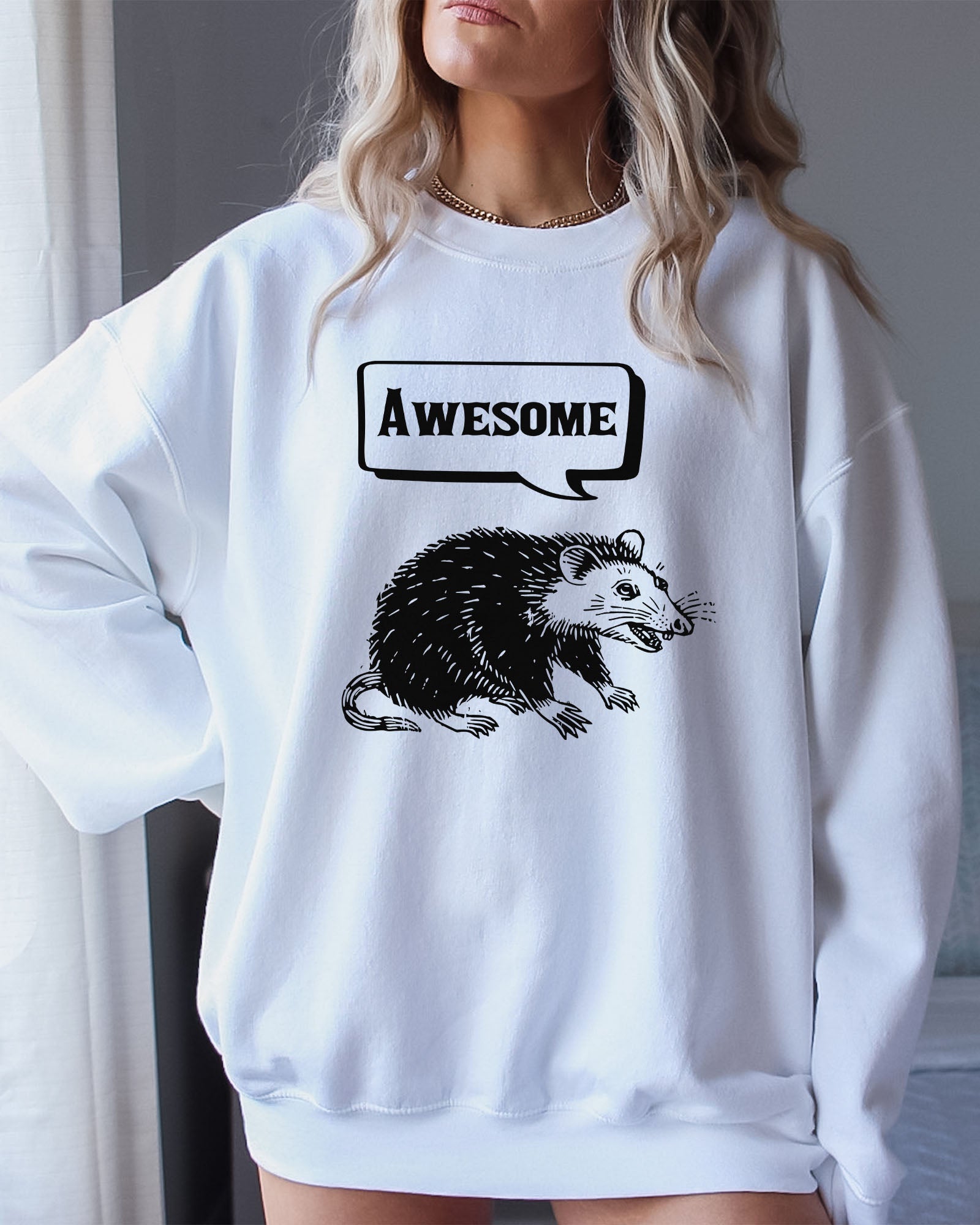 Model wearing white color sweatshirt with 'Awesome Opossum' graphic design