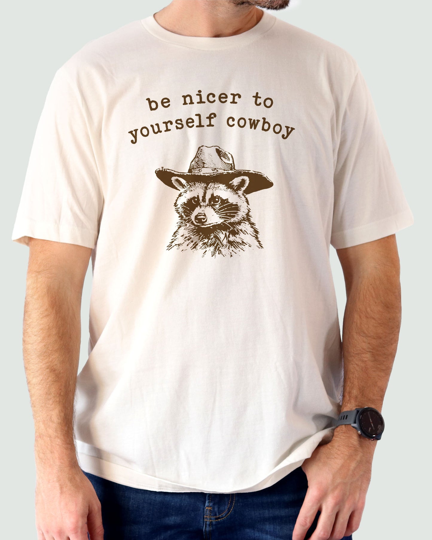 Be Nicer To Yourself Cowboy Shirt in natural color with retro cowboy raccoon graphic