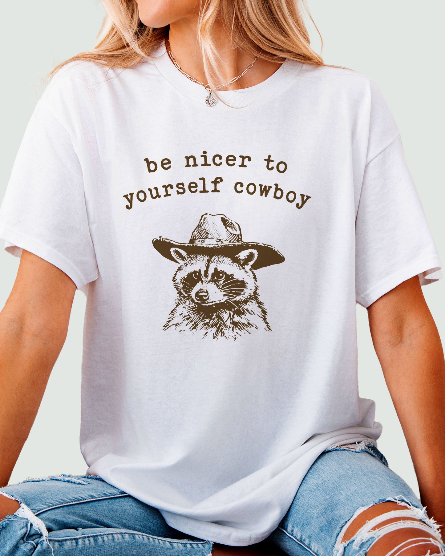 Be Nicer To Yourself Cowboy Shirt in white color with retro cowboy raccoon graphic