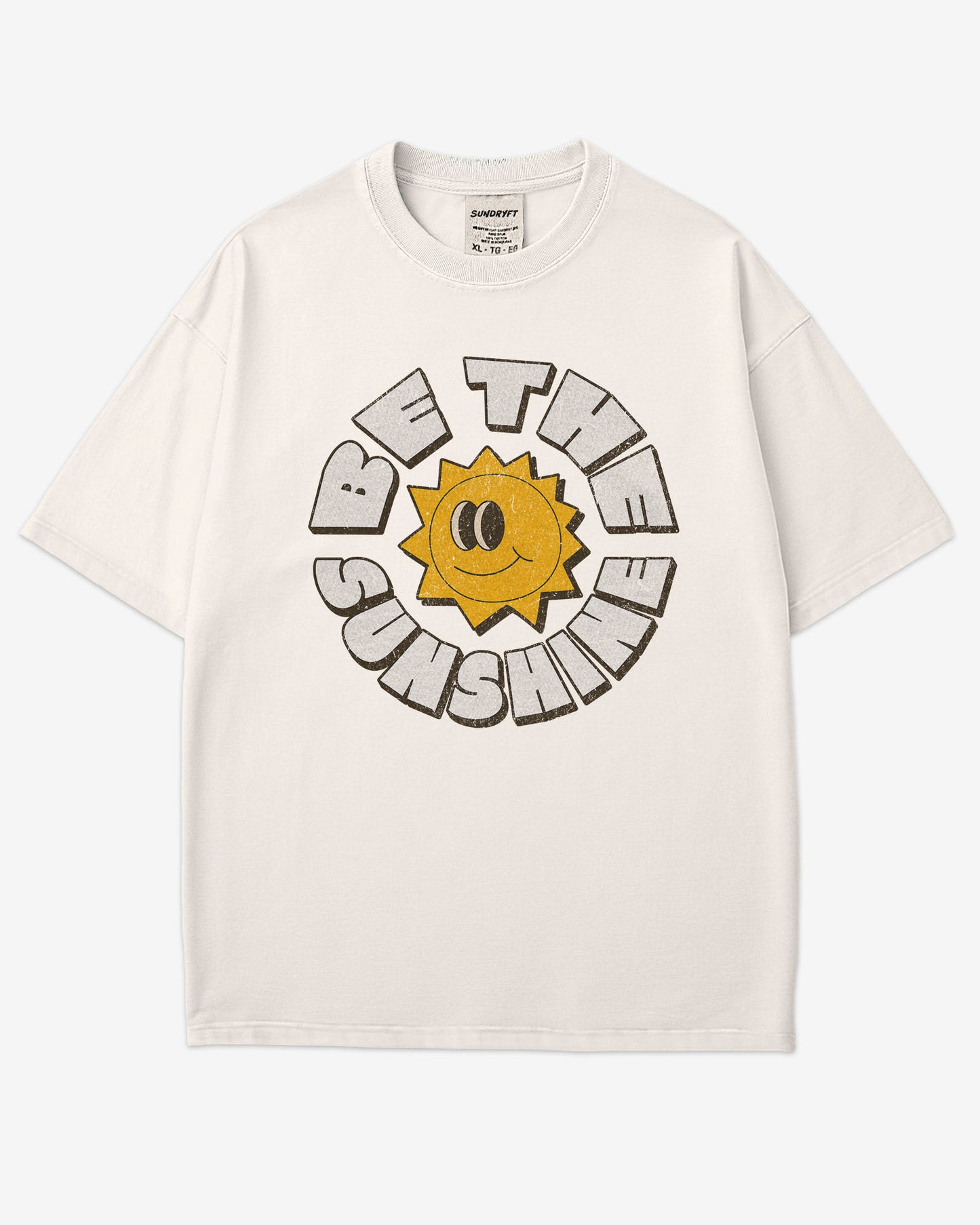 Flat lay ivory-colored Be The Sunshine shirt with a retro boho sun graphic.