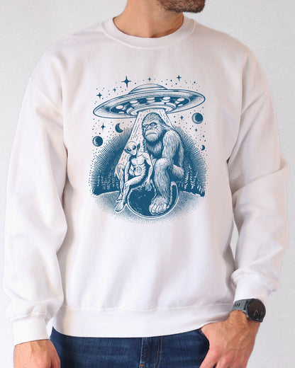 Model wearing white color sweatshirt with 'Bigfoot, Alien And UFO' graphic design