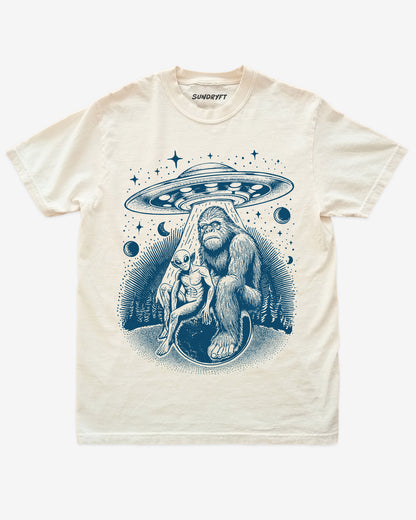 Bigfoot Alien UFO Shirt on ivory tee with retro cosmic forest design