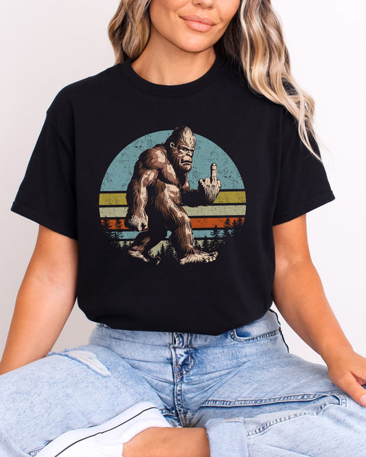 Model wearing black color shirt with 'Bigfoot Showing Middle Finger' graphic design