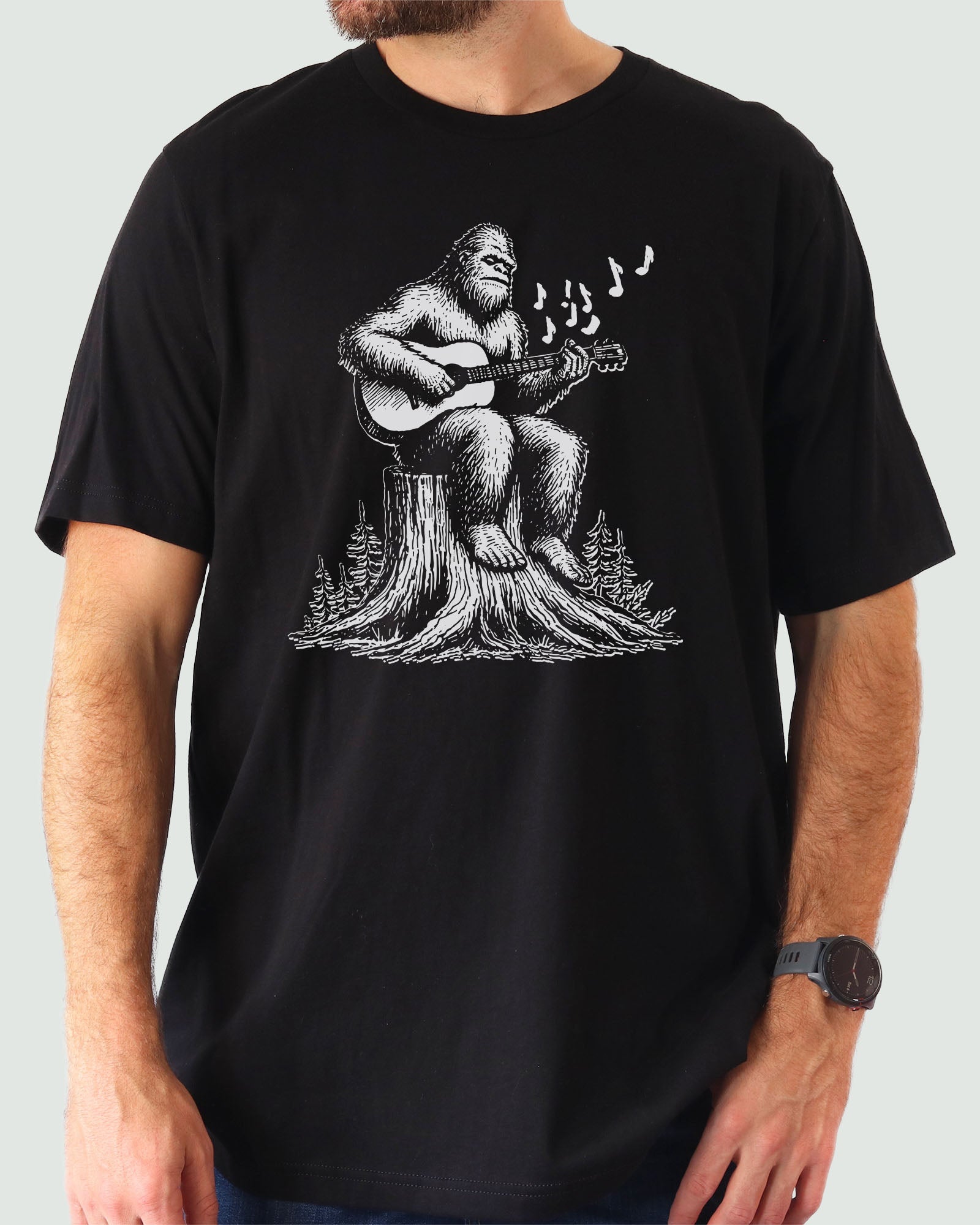 Bigfoot Playing Guitar Shirt black color tee with funny retro graphic of Bigfoot playing guitar