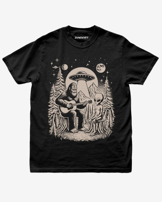 Bigfoot Playing Guitar With Alien And UFO Shirt on black tee with funny forest UFO design