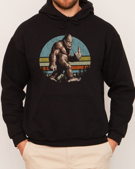 Man wearing a black hoodie with a funny retro graphic of Bigfoot showing the middle finger.