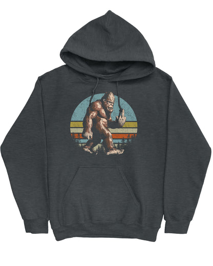 Flat lay of a dark heather hoodie with a funny retro graphic of Bigfoot showing the middle finger.