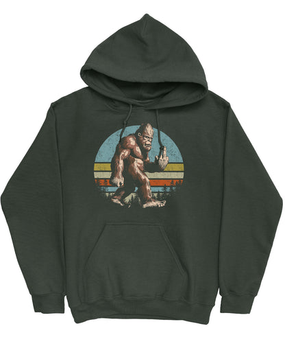 Flat lay of a forest green hoodie with a funny retro graphic of Bigfoot showing the middle finger.