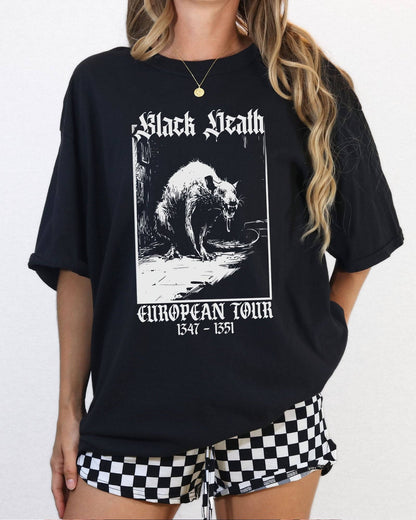 Woman wearing a black color 'Black Death European Tour 1347–1351' shirt with a retro graphic of a medieval plague rat.