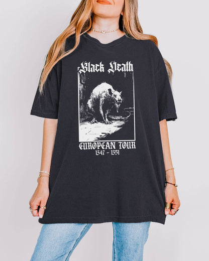 Woman wearing a graphite-colored 'Black Death European Tour 1347–1351' shirt with a retro graphic of a medieval plague rat.