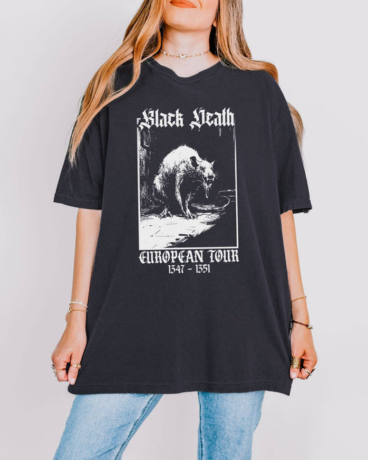 Woman wearing a graphite-colored 'Black Death European Tour 1347–1351' shirt with a retro graphic of a medieval plague rat.