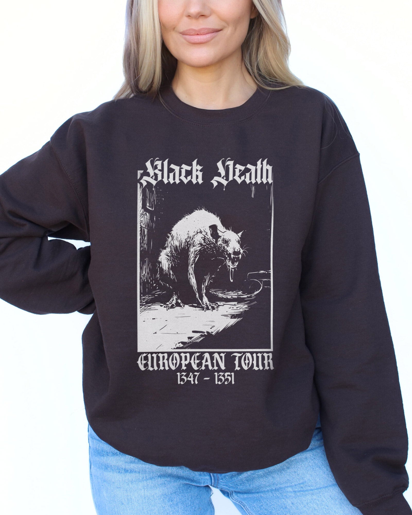Woman wearing dark chocolate "Black Death European Tour" sweatshirt with funny retro medieval rat graphic
