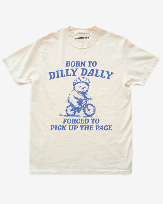Born To Dilly Dally Forced To Pick Up The Pace shirt in ivory with bear riding bicycle graphic