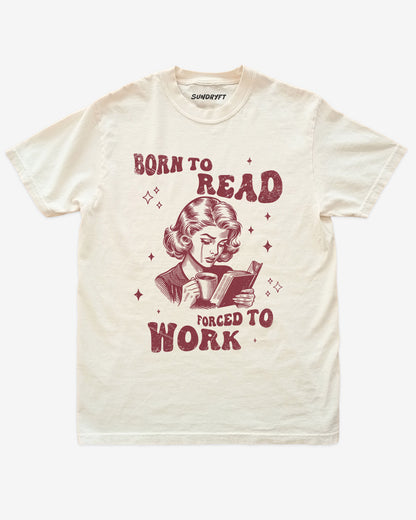 Born To Read Forced To Work shirt in ivory with retro graphic of crying woman reading a book