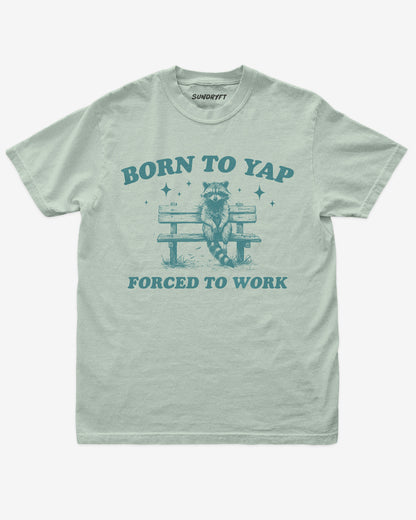 Born To Yap Forced To Work shirt in bay with funny retro graphic of raccoon sitting on bench
