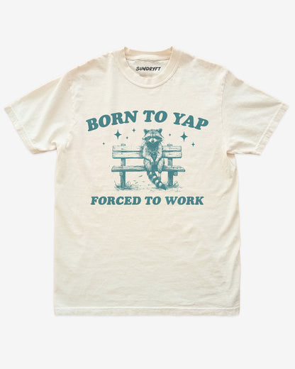 Born To Yap Forced To Work shirt in ivory with funny retro graphic of raccoon sitting on bench