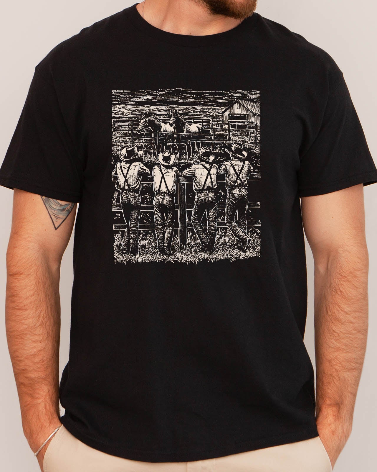 Man wearing retro graphic cowboy gang shirt in black color