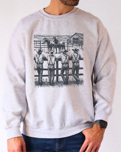 Model wearing ash color sweatshirt with 'Cowboy Gang' graphic design