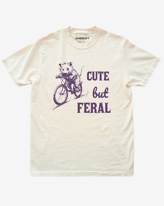 Cute But Feral shirt in ivory with retro graphic of cute rat riding a bike
