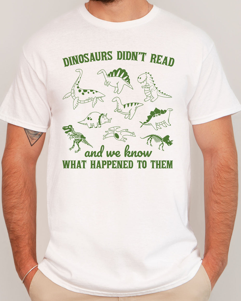 Funny reading motivation shirt in white color with the quote "Dinosaurs didn't read and we know what happened to them"