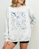 Model wearing ash color sweatshirt with 'Dinosaurs In Space' graphic design
