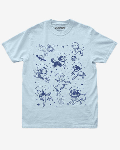 Flat lay of chambray Dogs In Space Shirt, retro 90s vintage graphic tee with funny astronaut dogs floating in space