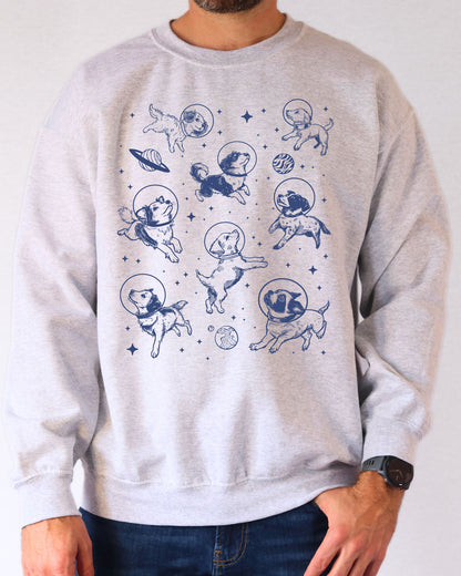 Model wearing ash color sweatshirt with 'Dogs In Space' graphic design