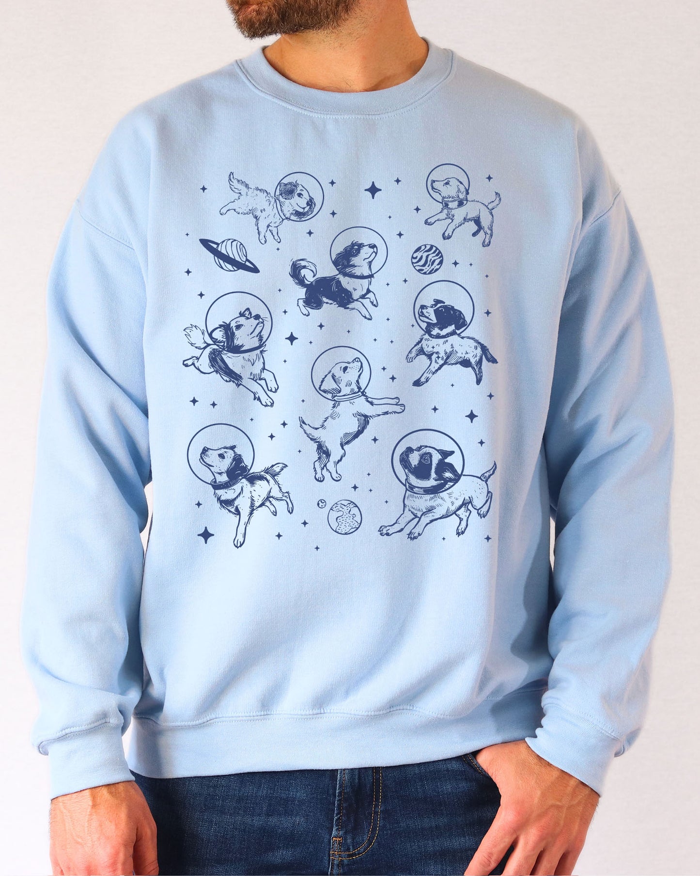Model wearing light blue color sweatshirt with 'Dogs In Space' graphic design