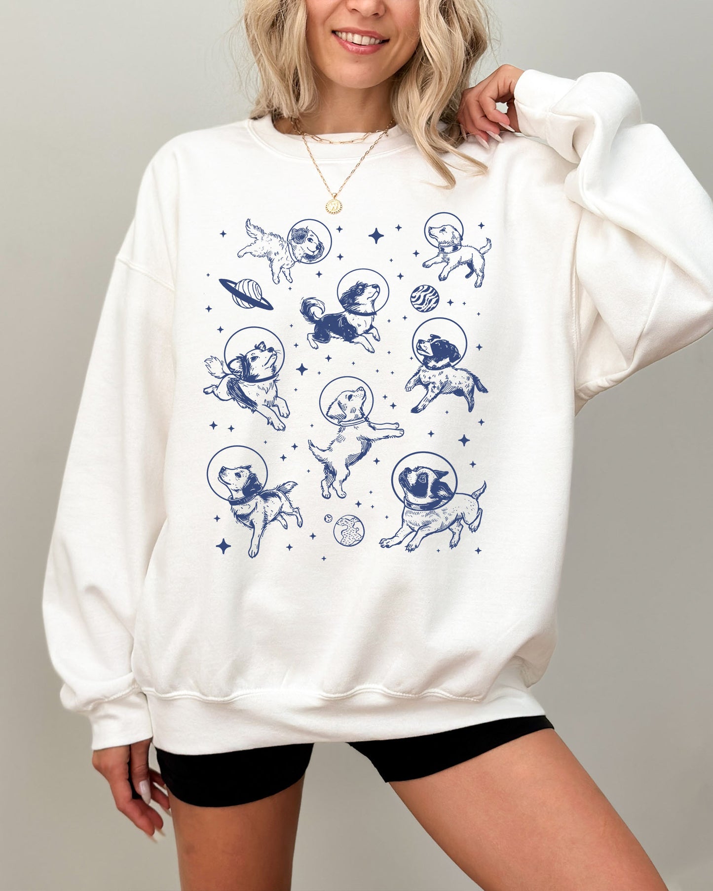 Model wearing white color sweatshirt with 'Dogs In Space' graphic design